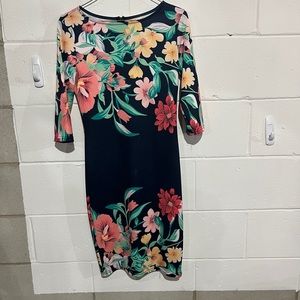 Fall dress with long sleeves covered with flowers on sleeves and at the bottom